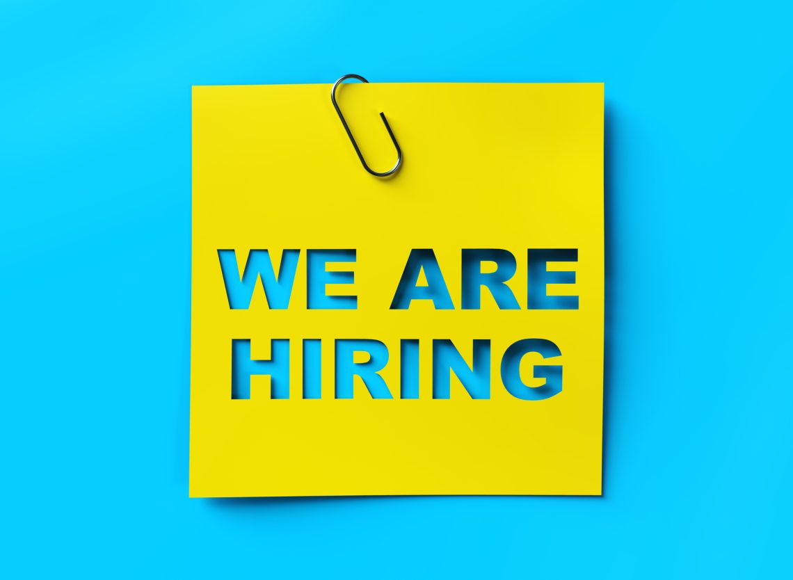 “We are hiring” yellow banner on blue textured background